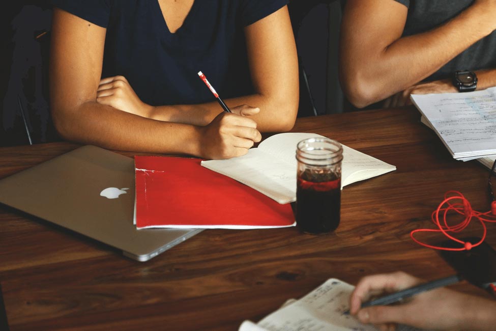 A woman taking notes in a meetings