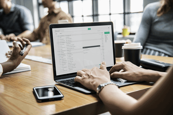 A woman on her laptop writing an email