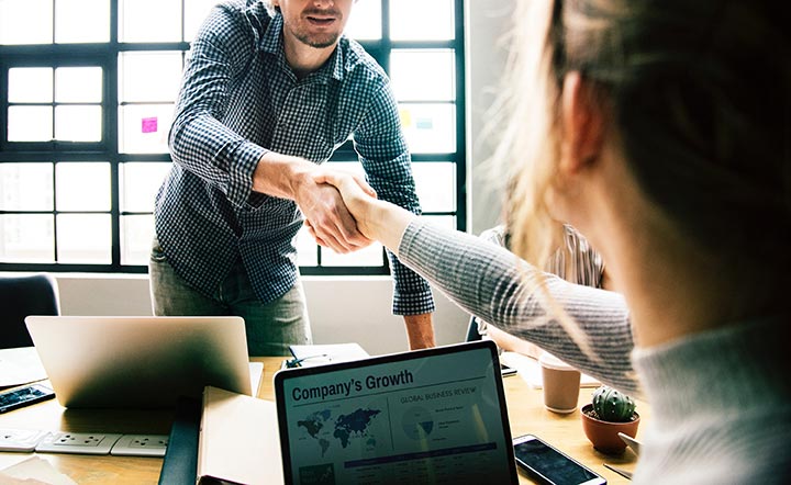 Man and woman shaking hands