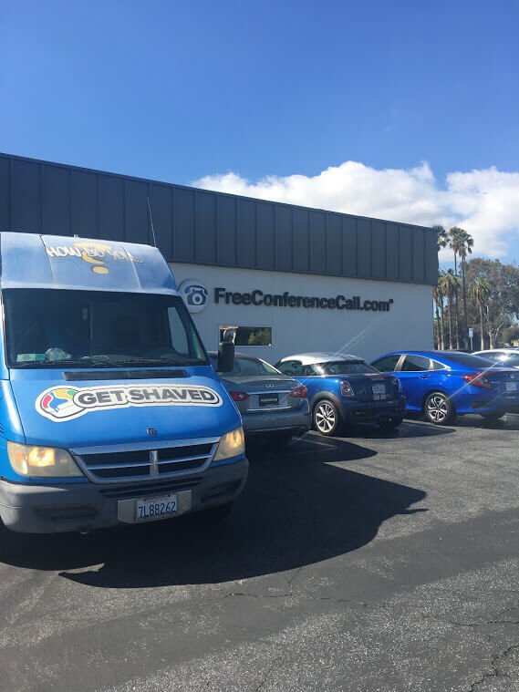 The GetShaved ice cream truck parked in the free conference call parking lot