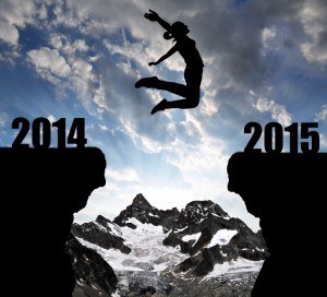 A woman jumping from the 2014 cliff to the 2015 cliff