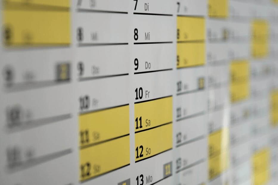 A yellow and white wall calendar